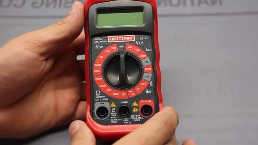 How do I switch the multimeter from AC to DC voltage