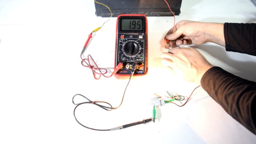 Place the black lead on the negative terminal