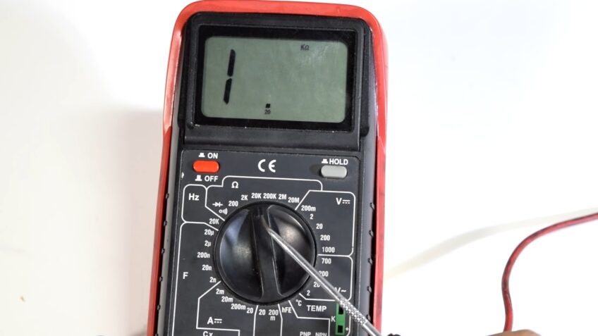 Read the voltage on the multimeter's display